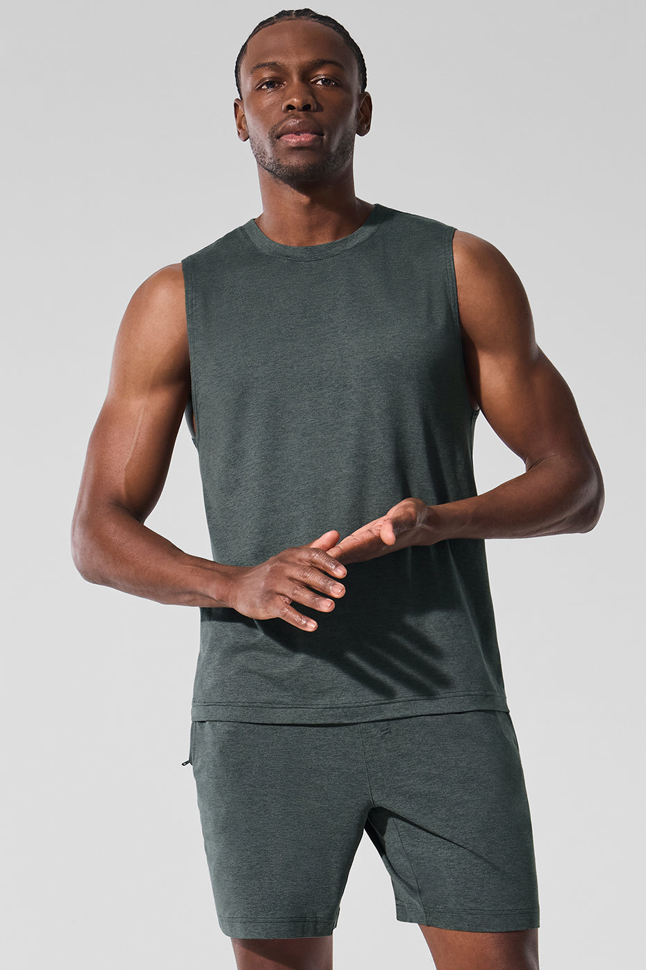 Front view of the Conquer Performance Muscle Tank in Charcoal Green Heather.
