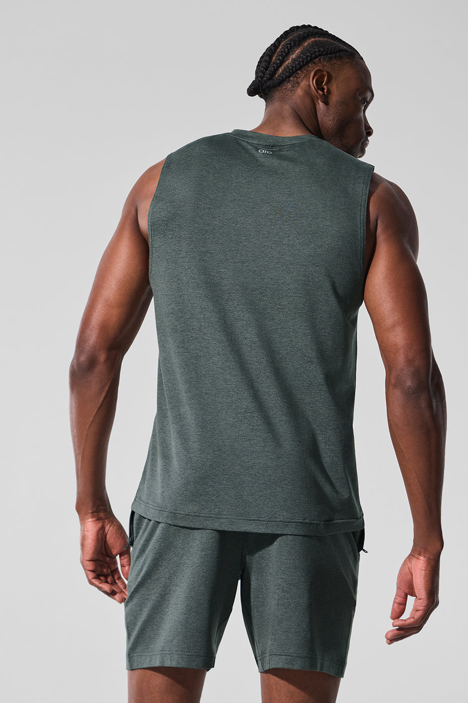 Side view showcasing the wide armholes of the muscle tank.