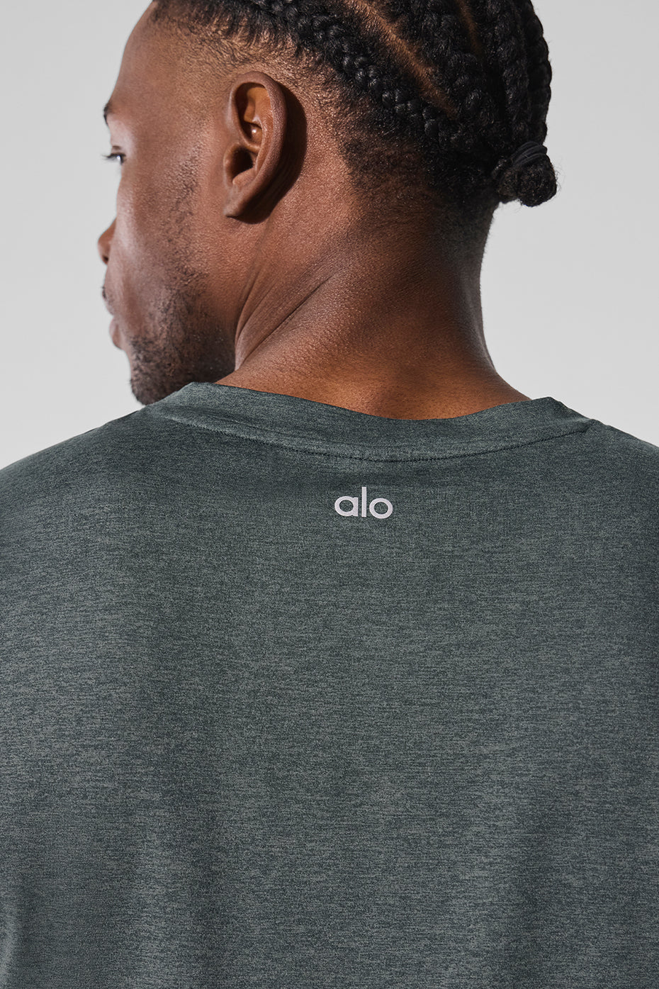 Front view of the Conquer Performance Muscle Tank in Charcoal Green Heather.