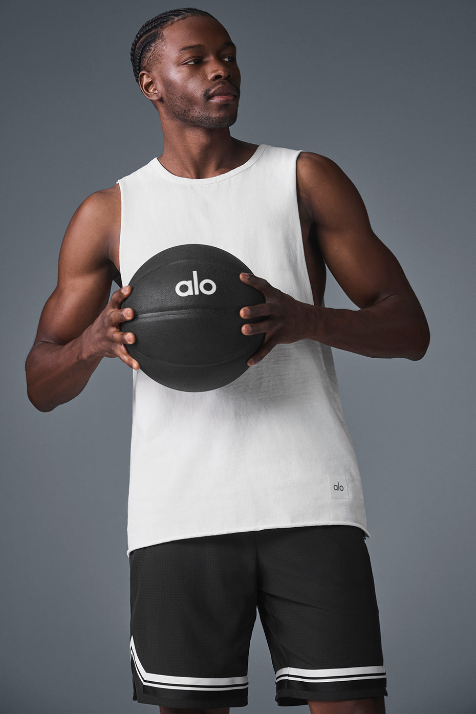Model wearing a gym tank top with raw edge hem during workout