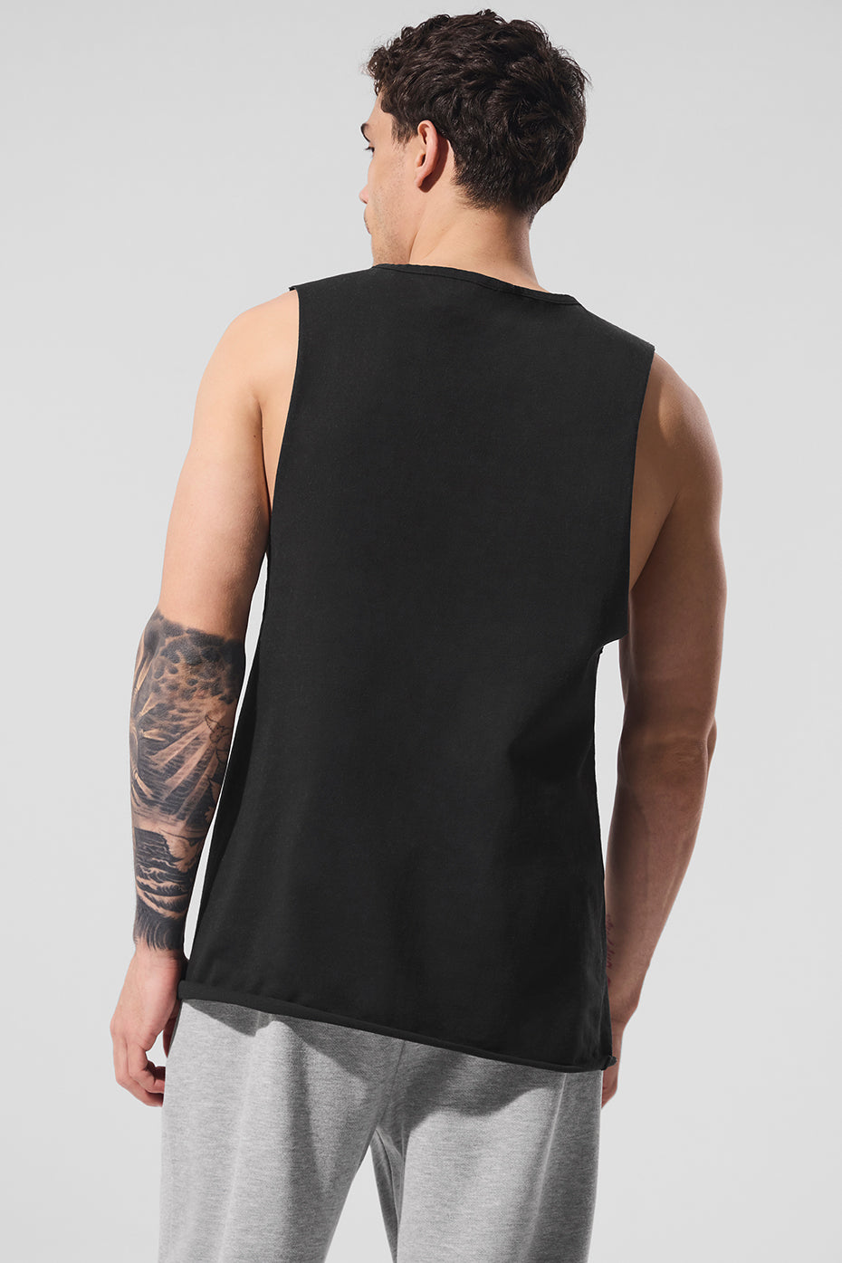 Back view of the black tank top highlighting its comfortable fit.