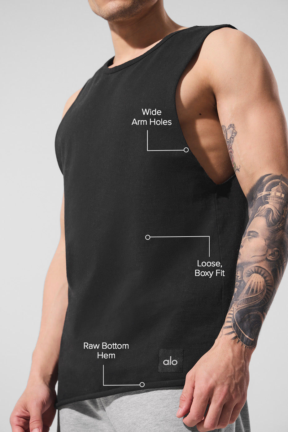 Side view of the black tank top, perfect for gym wear.