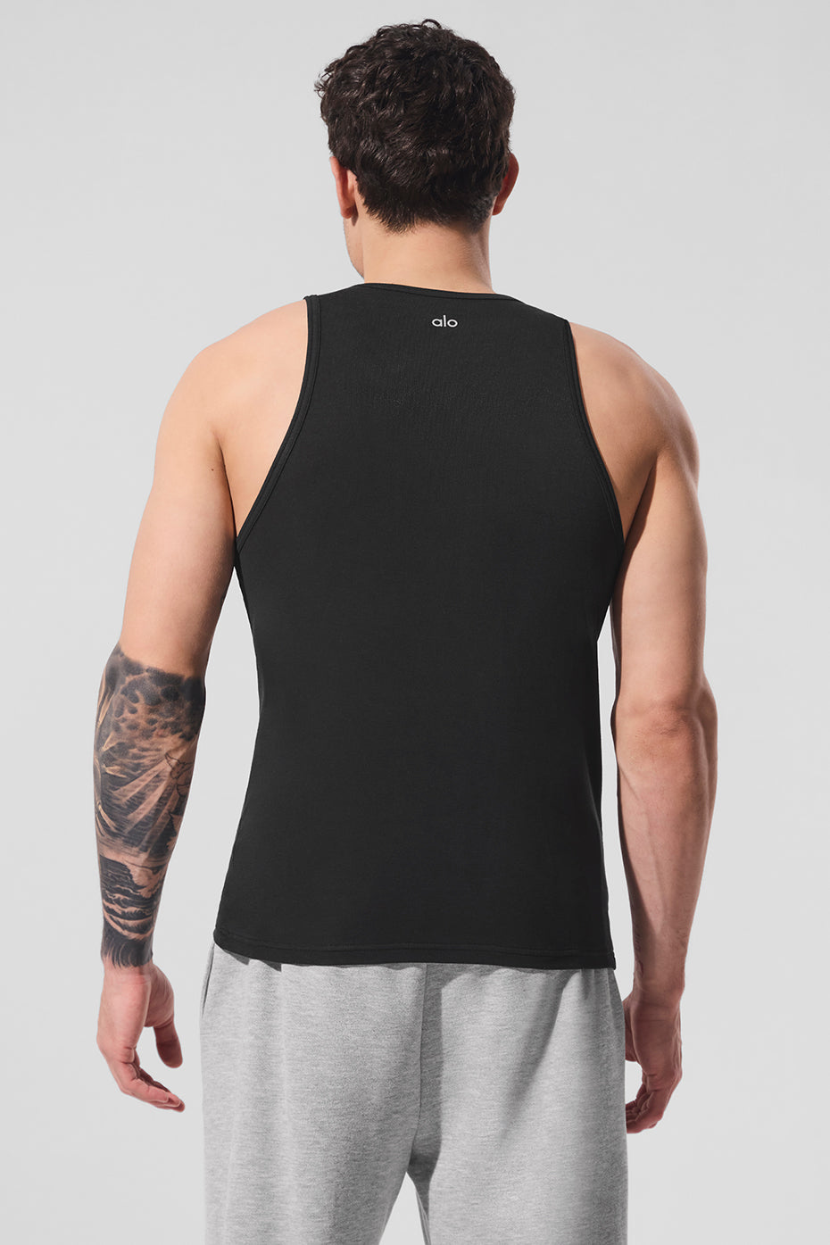 Side view of the womens ribbed tank top, highlighting the racerback straps.