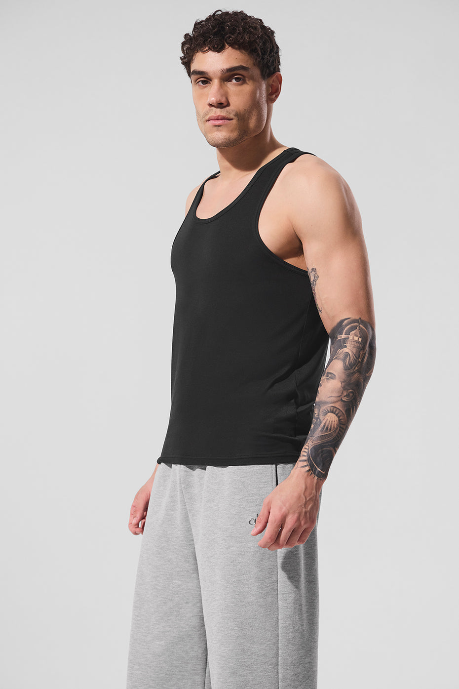 Model wearing the Everyday Modal Racerback Tank during a workout session.