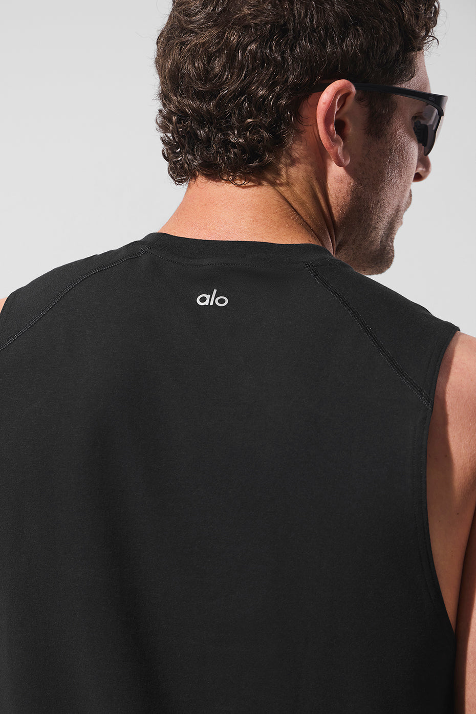 Side profile of the muscle tank showcasing its breathable fabric