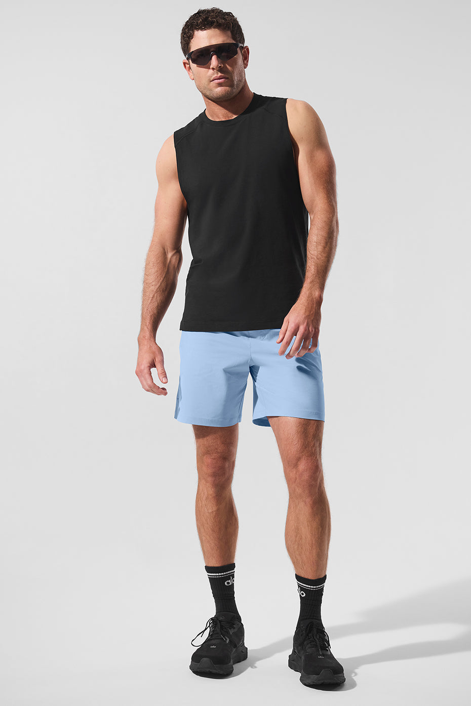 Side profile of the muscle tank showcasing its breathable fabric