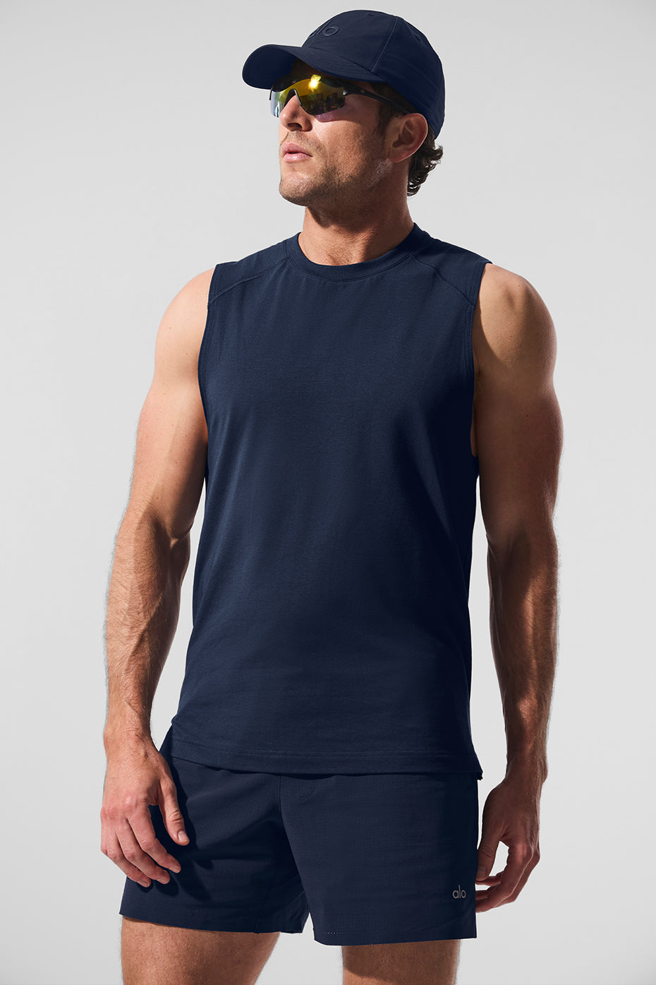 Front angle of ALO muscle tank showing navy color and sleek fit