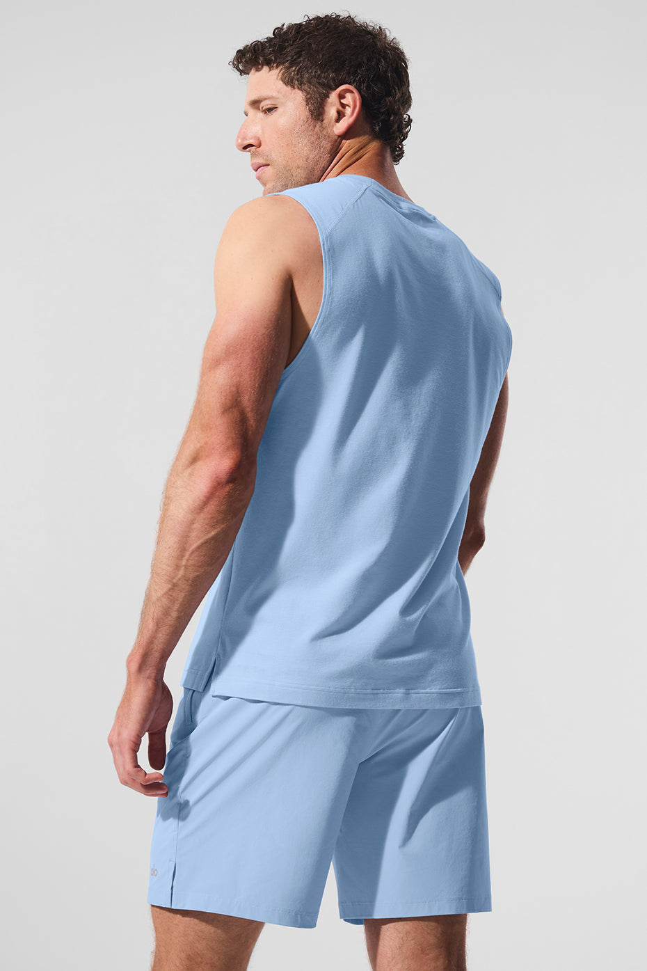 Side profile of the breathable sweat-wicking shirt on an active woman