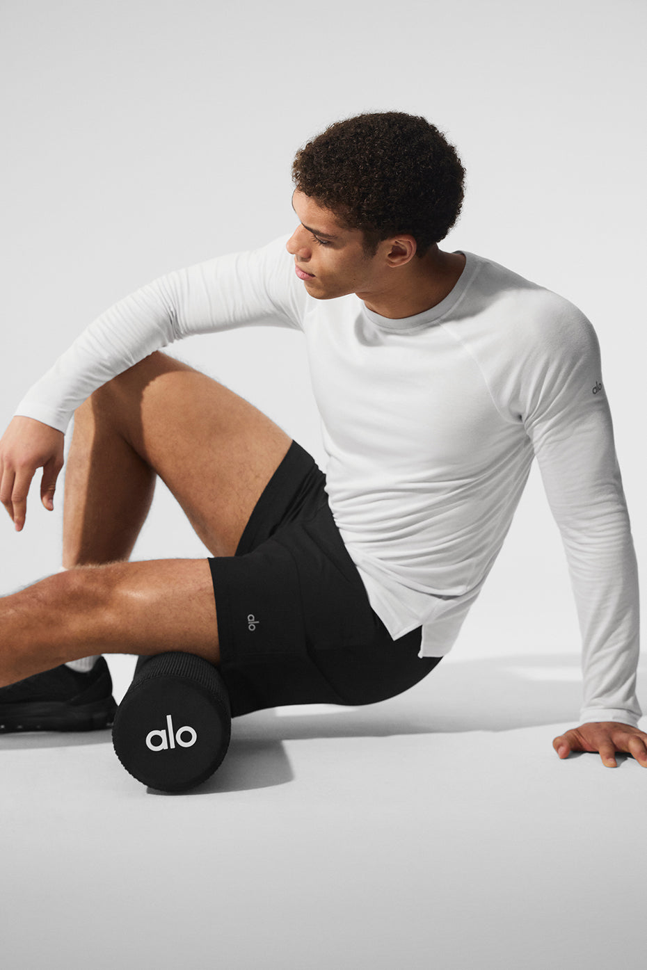 Front view of the white long sleeve t shirt on a model, showcasing slim fit and comfortable style