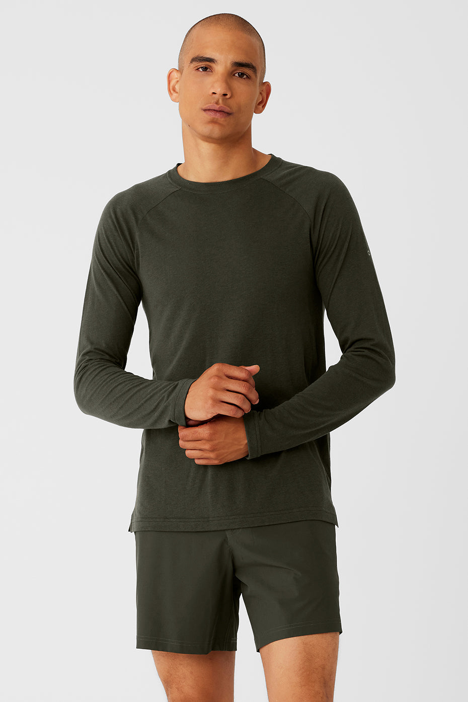 Front view of stealth green long sleeve tee styled for daily wear.