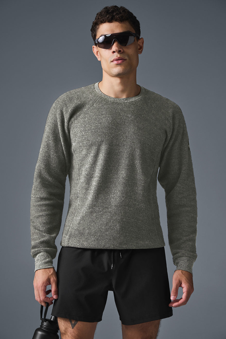 Front view of the grey crew neck sweatshirt highlighting the reverse side panels