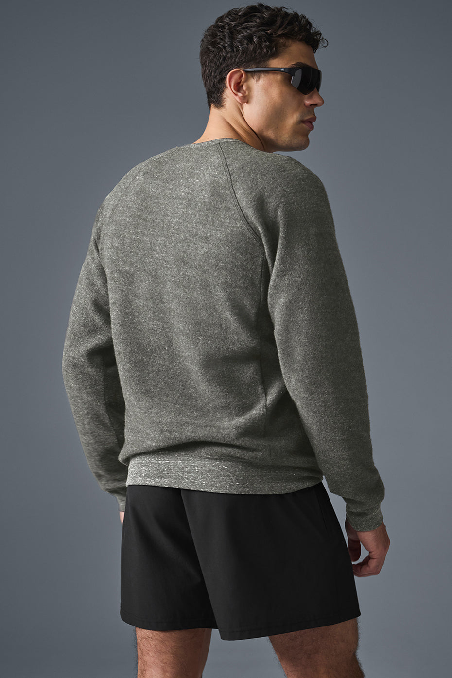 Detail of the hidden zipper pockets on the Alo Triumph sweatshirt
