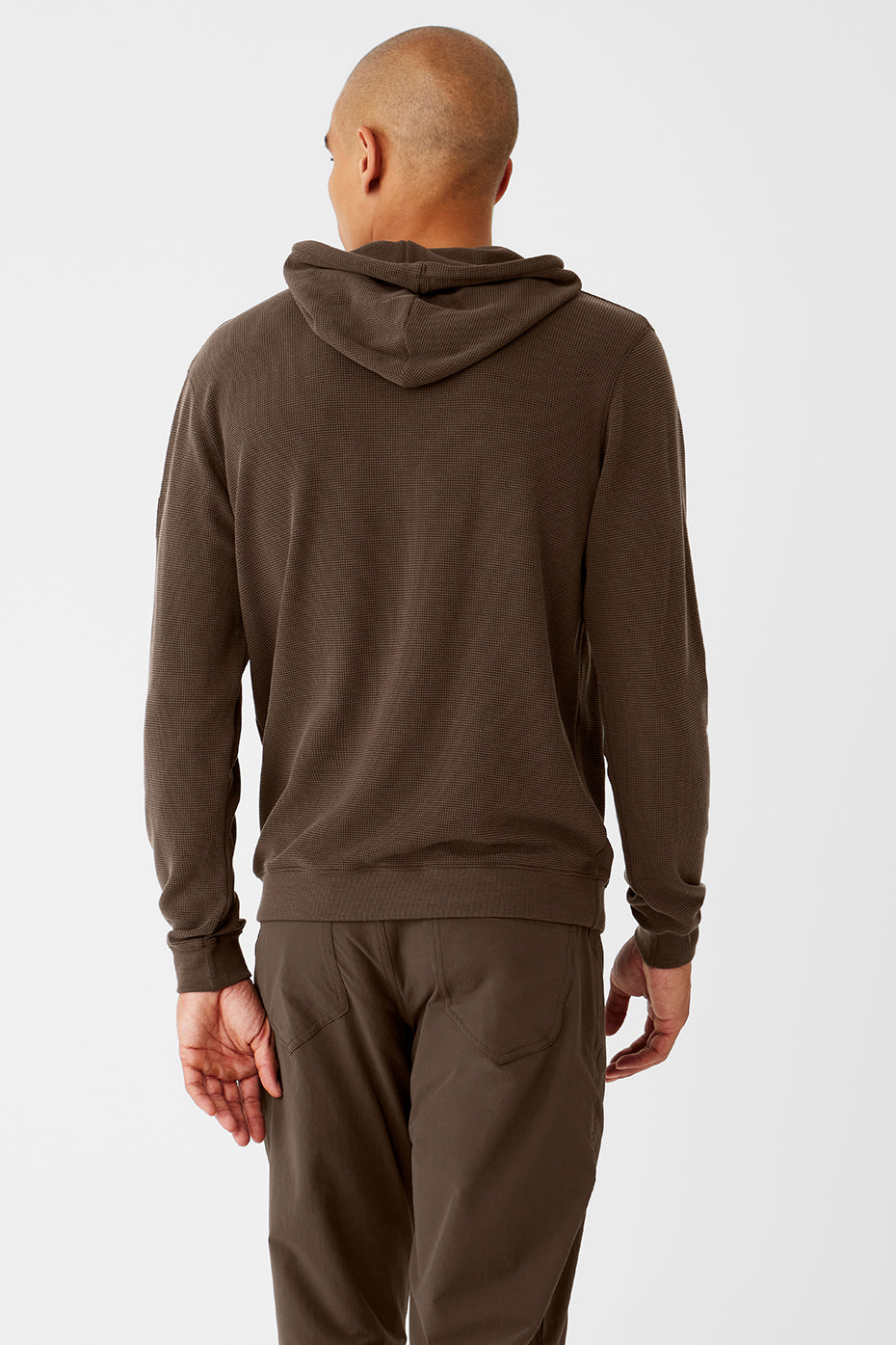 Model wearing the Espresso Comfort Hoodie in a relaxed outdoor setting.