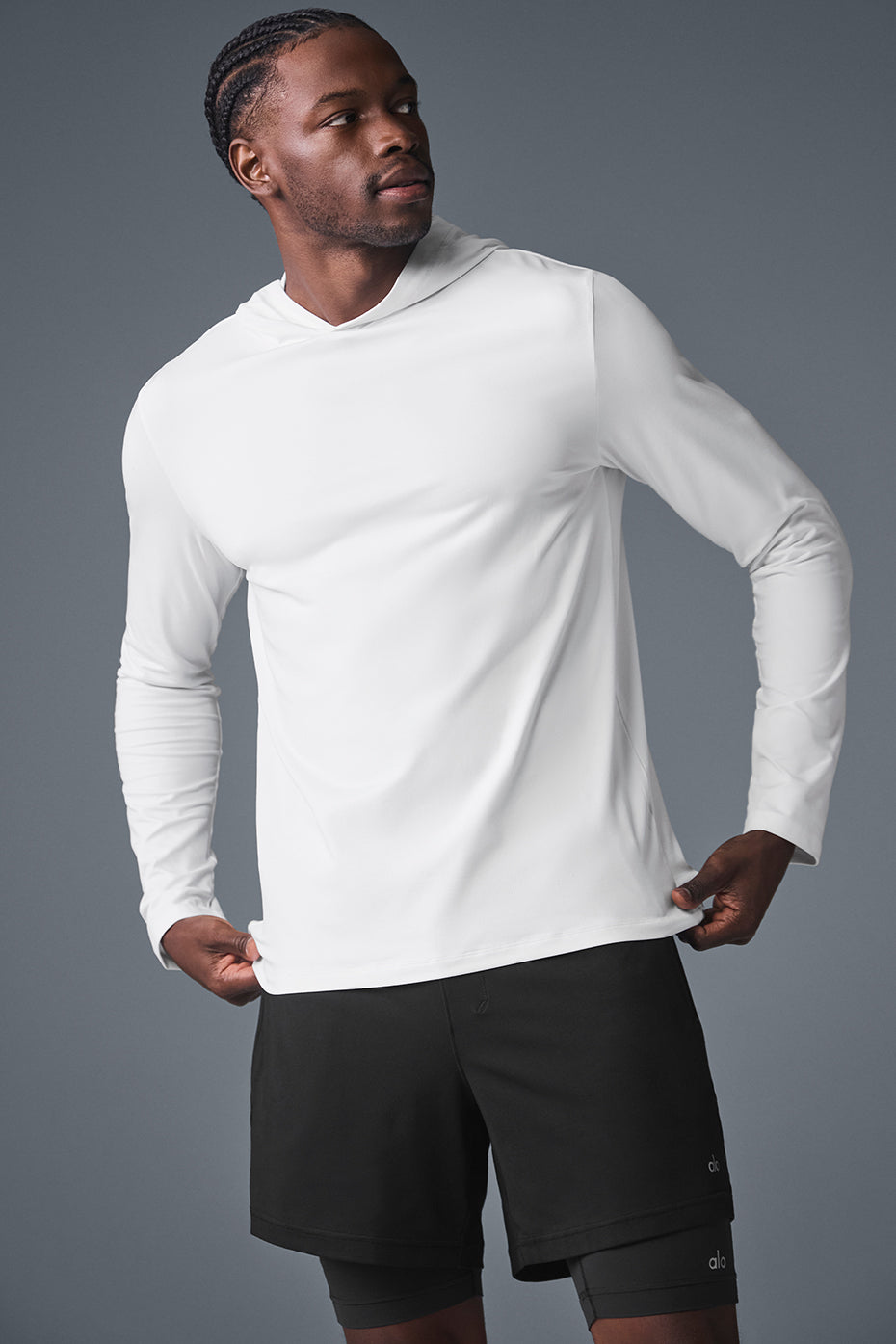 Front view of the white long sleeve workout shirt with a hood.
