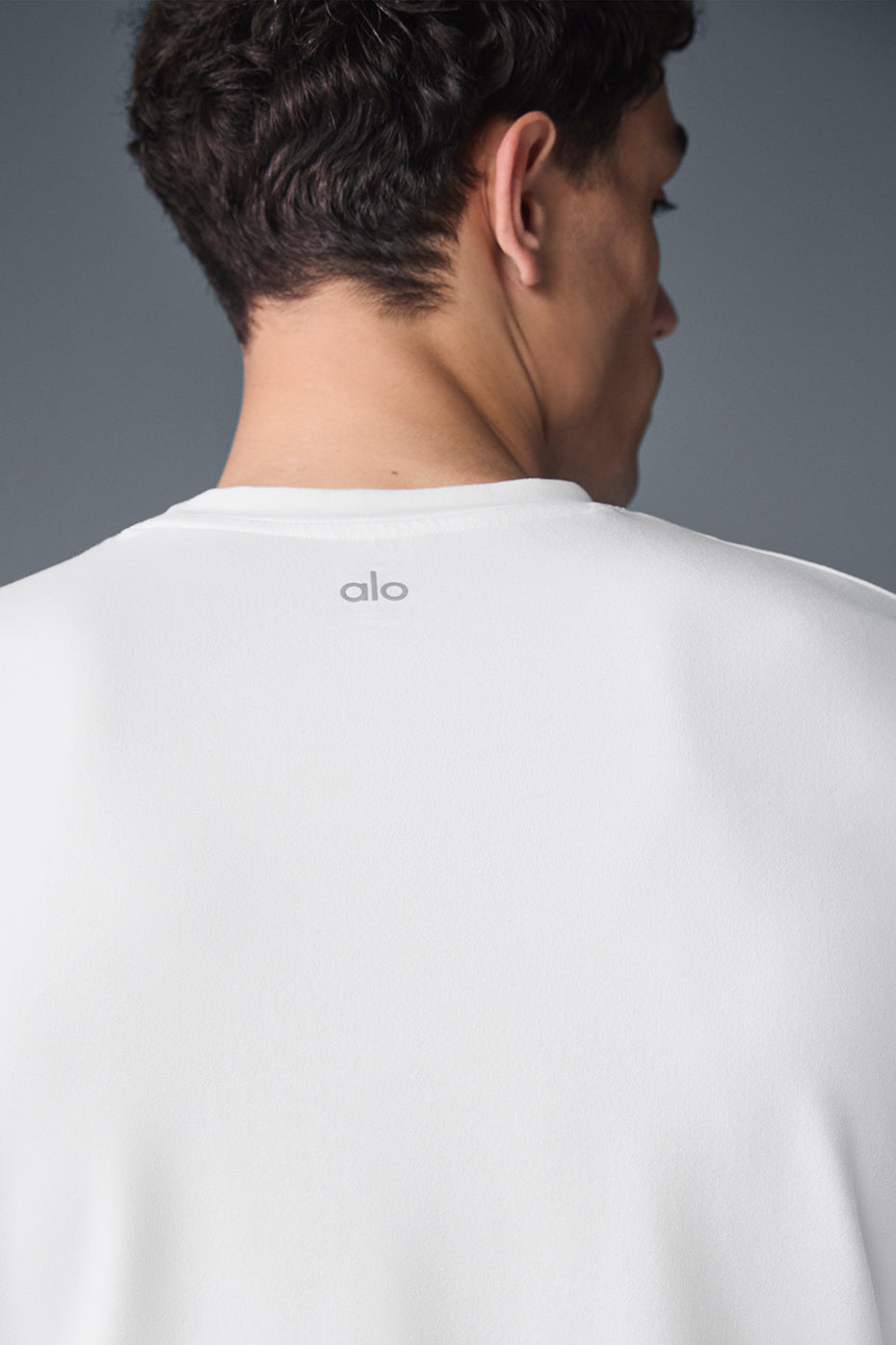 Front view of white long sleeve crewneck showing its soft fabric and relaxed fit