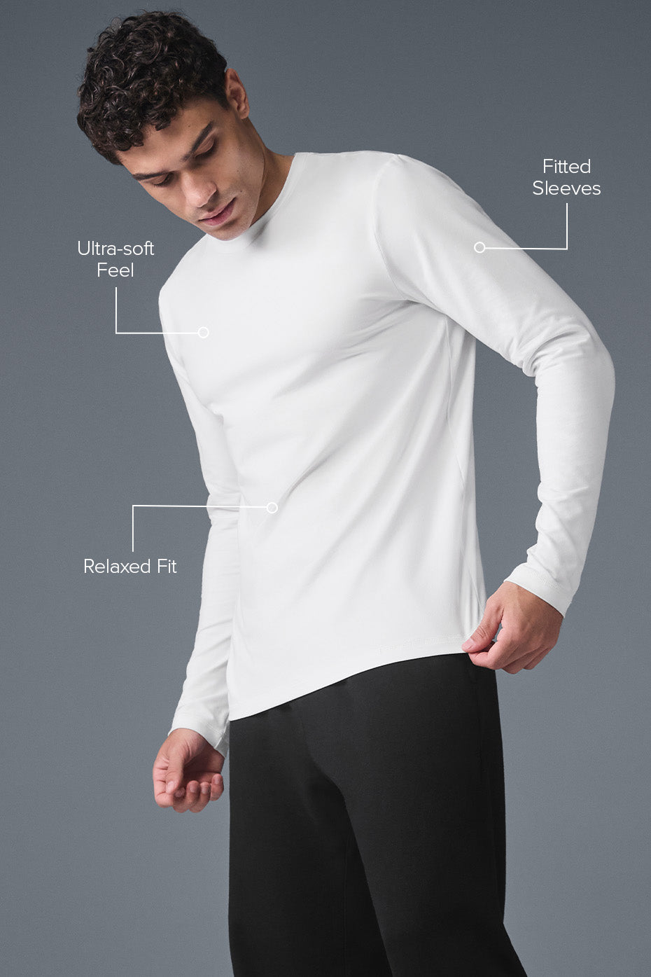 Model wearing a white long sleeve shirt layered under a jacket for casual street style
