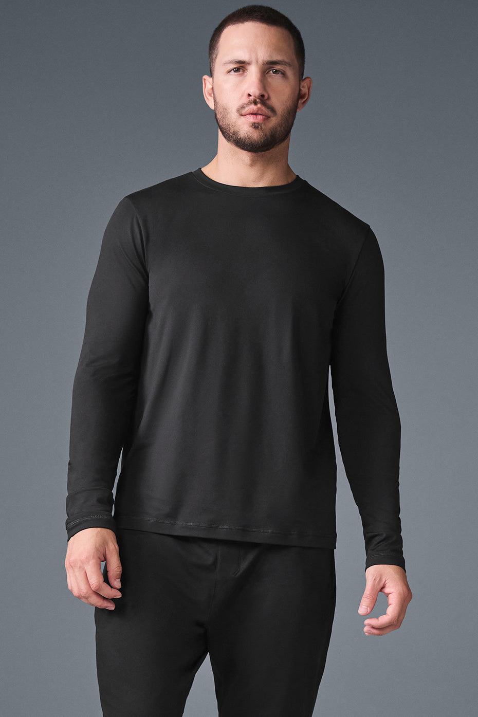 Front view of the Reform Crewneck Long Sleeve Shirt in black, highlighting its soft fabric.