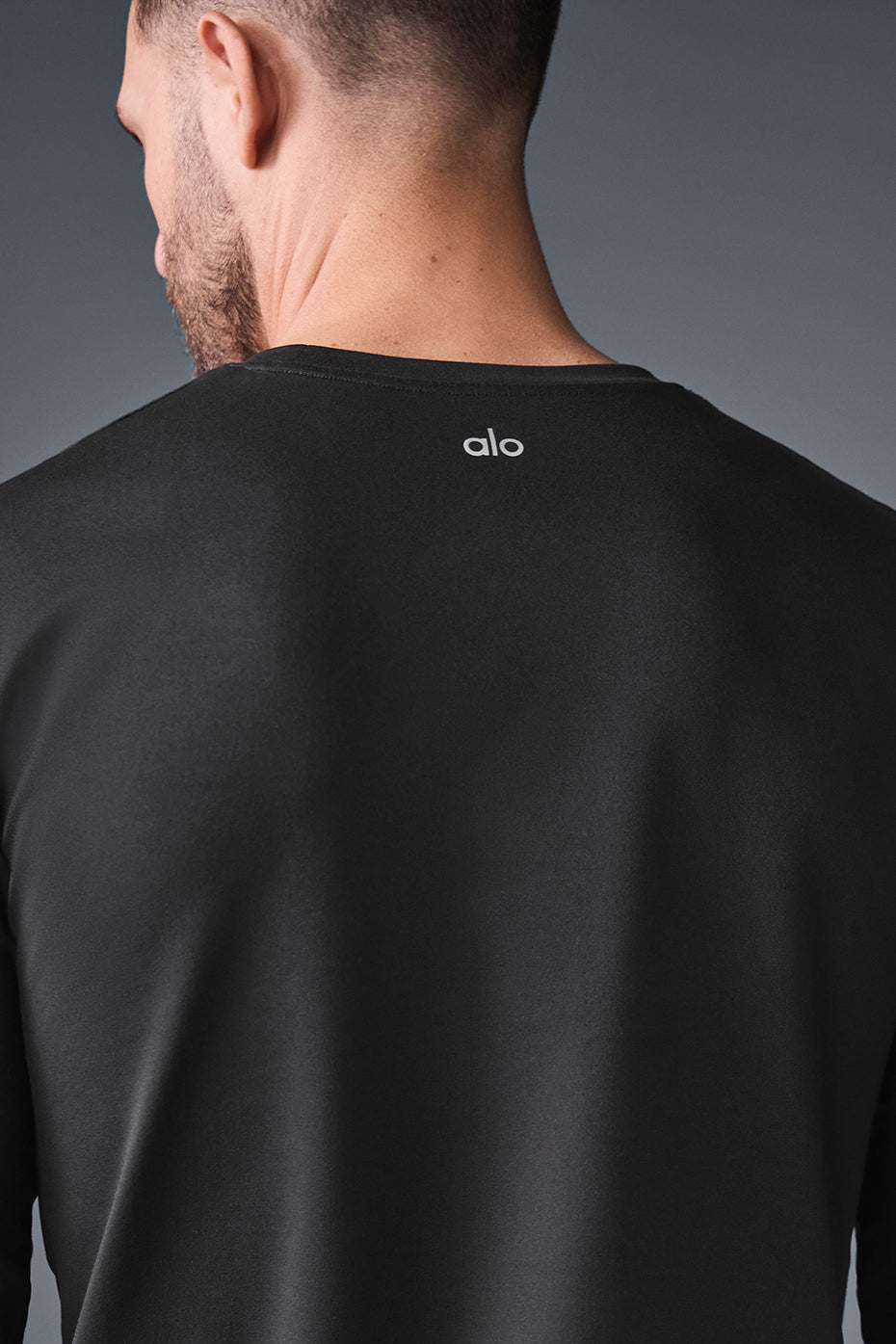 Front view of the Reform Crewneck Long Sleeve Shirt in black, highlighting its soft fabric.