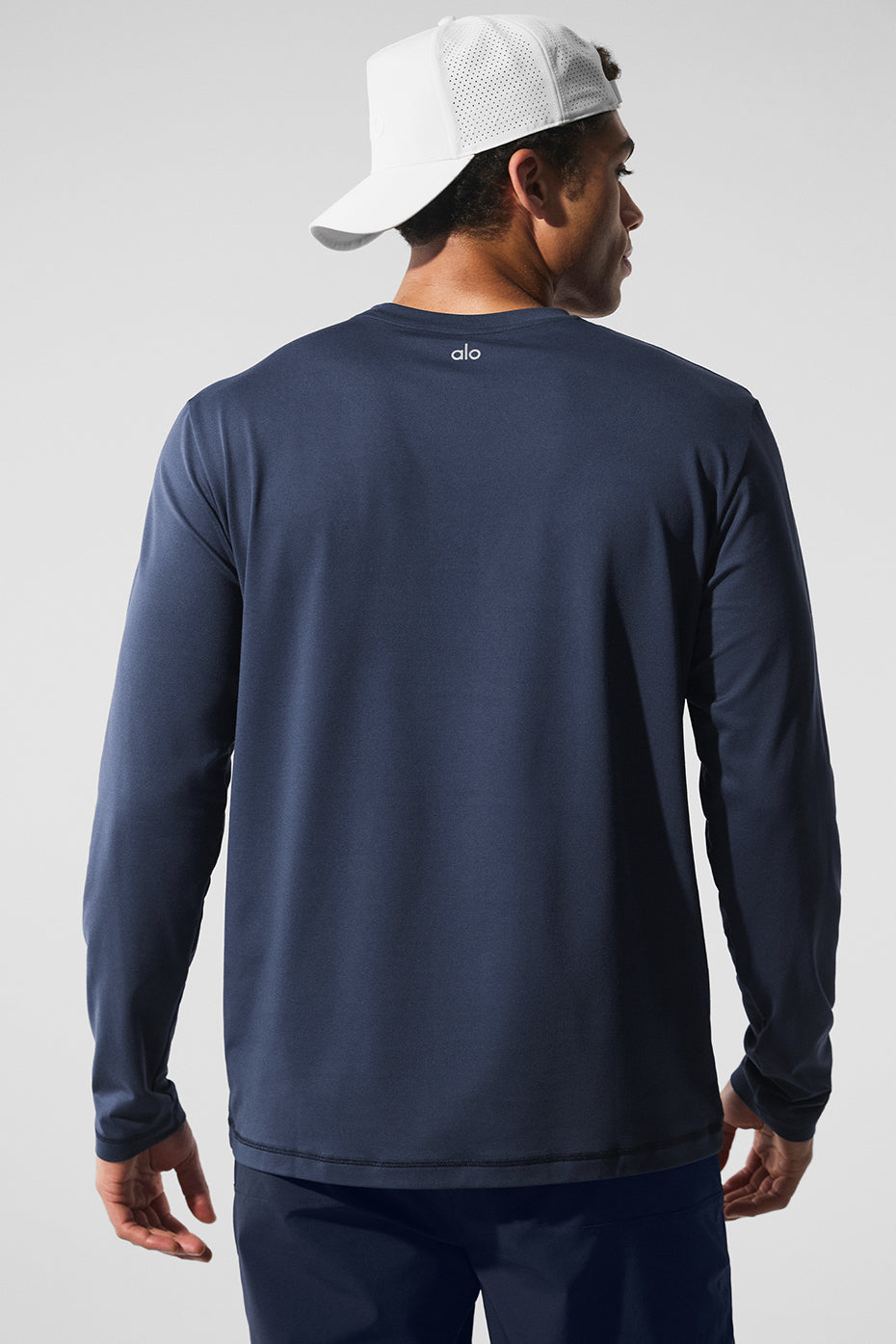 Casual streetwear look featuring navy crewneck sweatshirt under a jacket