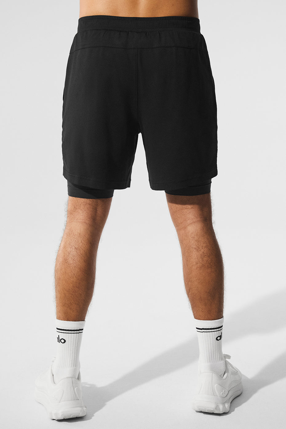 Side view of the Conquer React shorts, highlighting the built-in compression feature.
