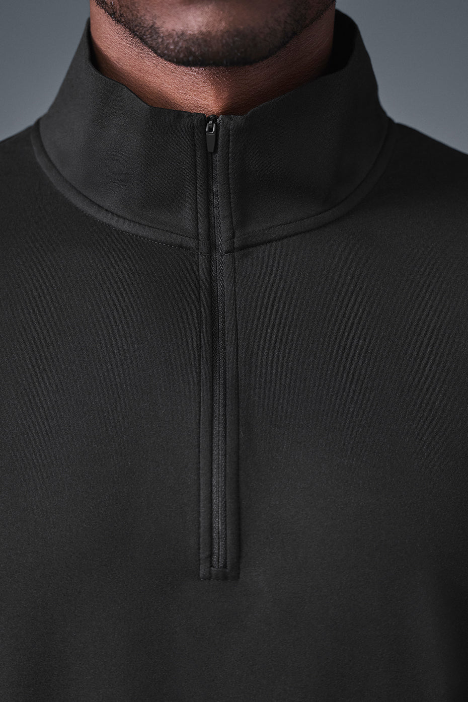 Front view of Elevate 1/4 Zip Long Sleeve shirt in black, showcasing its sleek design.