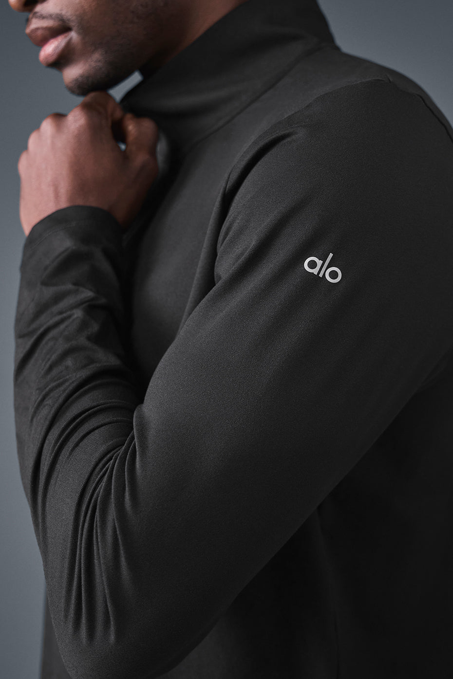 Side view of Elevate 1/4 Zip Long Sleeve shirt, highlighting the breathable fabric.