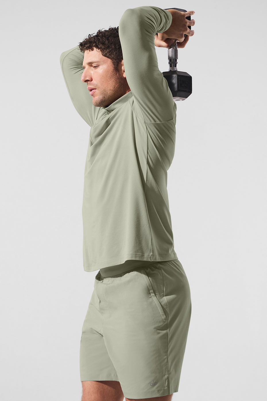 Back view highlighting the moisture-wicking design of the Limestone long sleeve workout shirt.