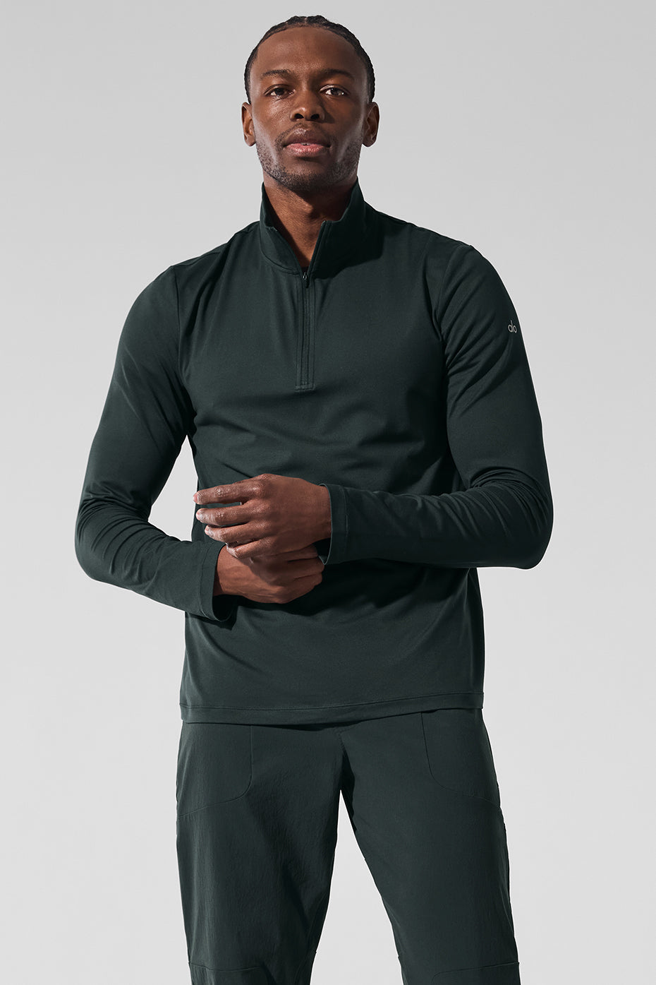 Front view of moisture-wicking long sleeve crop top in charcoal green.