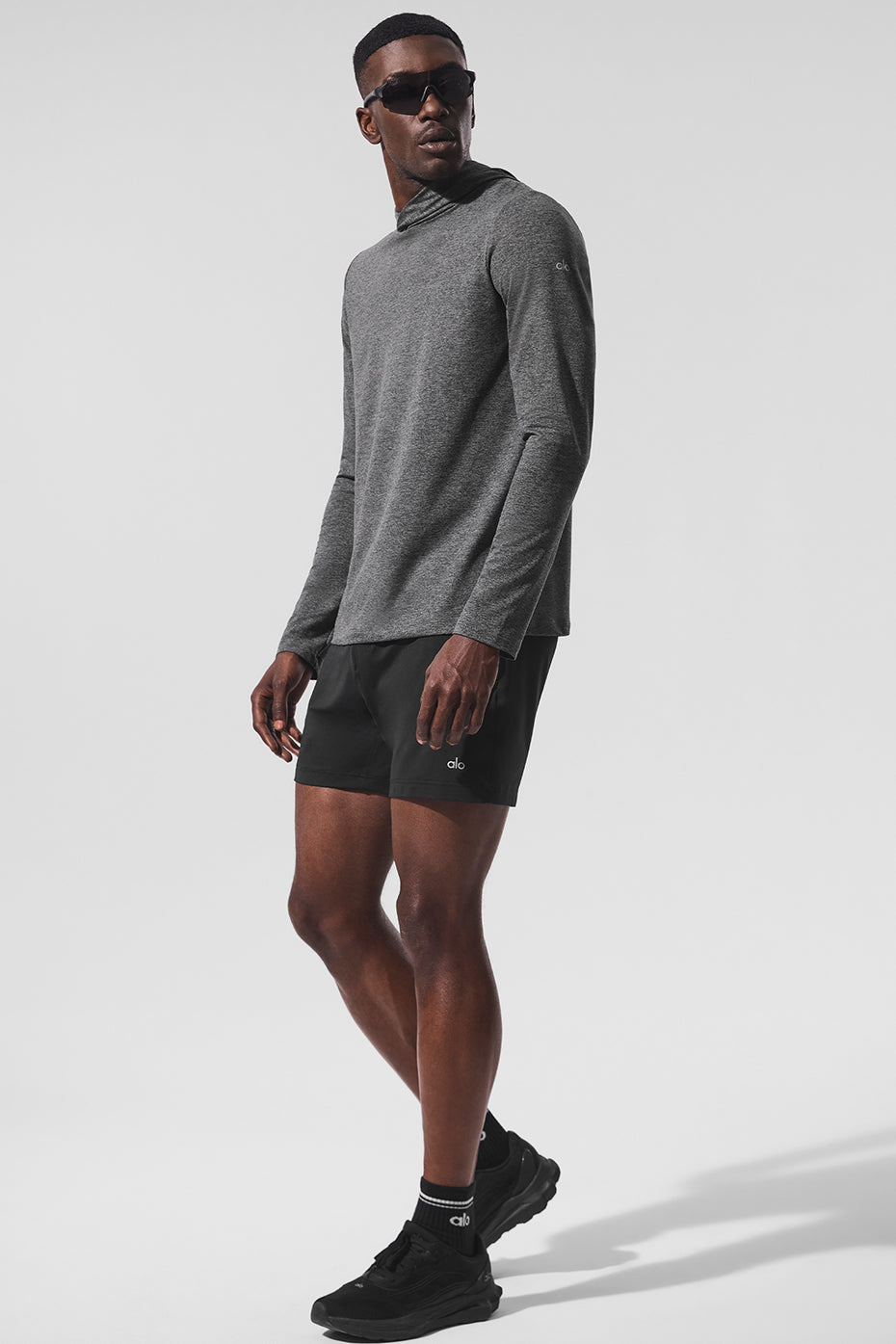 Long sleeve shirt hoodie draped on a gym bench
