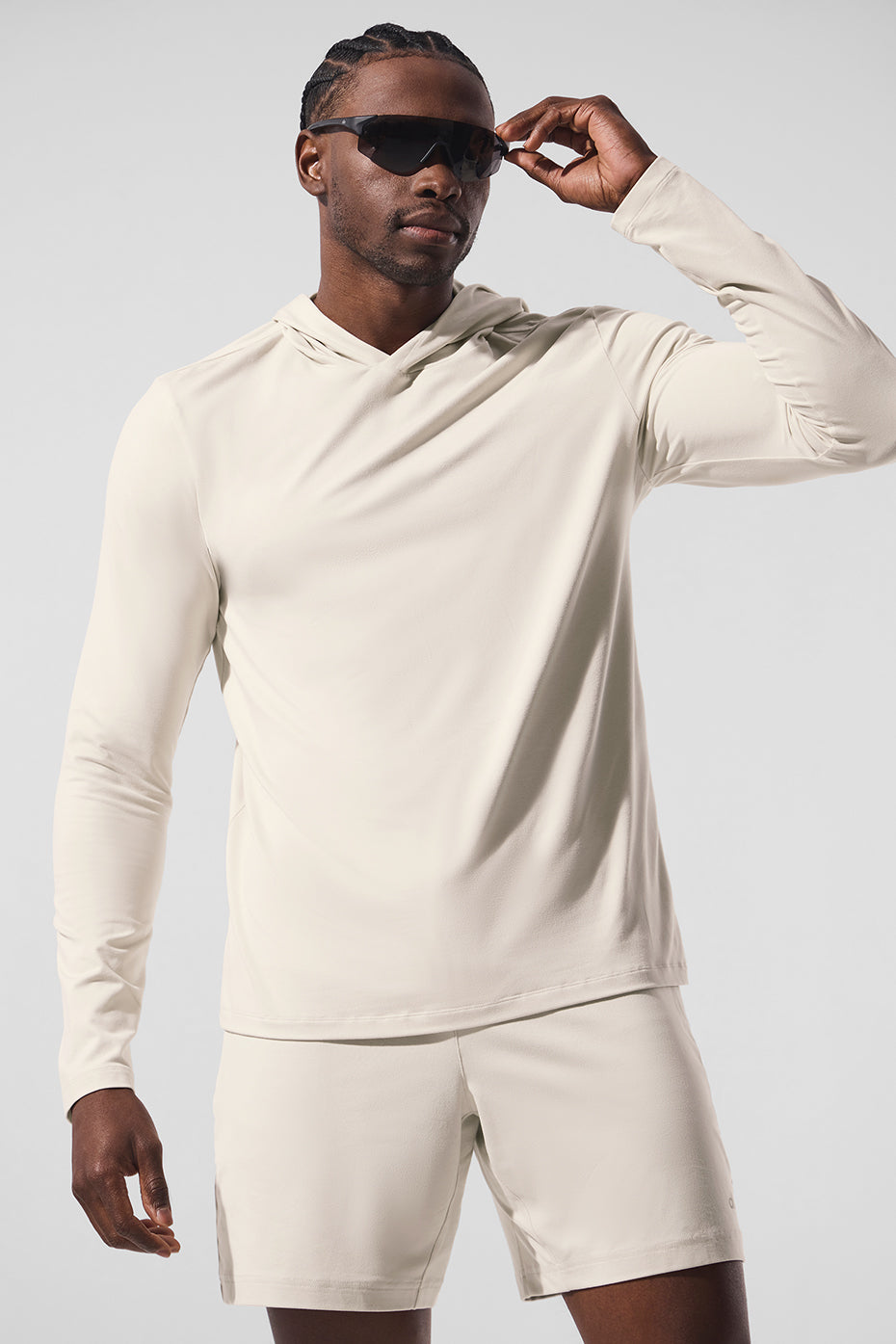 Front view of moisture wicking long sleeve hoodie in bone color, ideal for training.