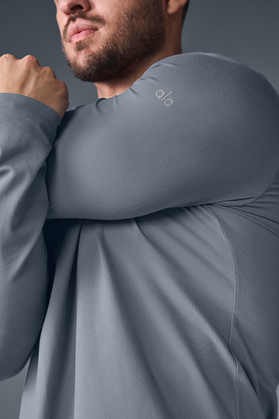 Close-up of the moisture-wicking long sleeve shirt fabric showing stretch and breathability