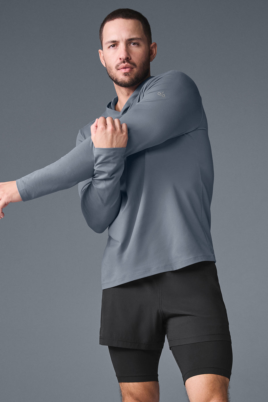Model wearing the training hoodie during a morning run in the park