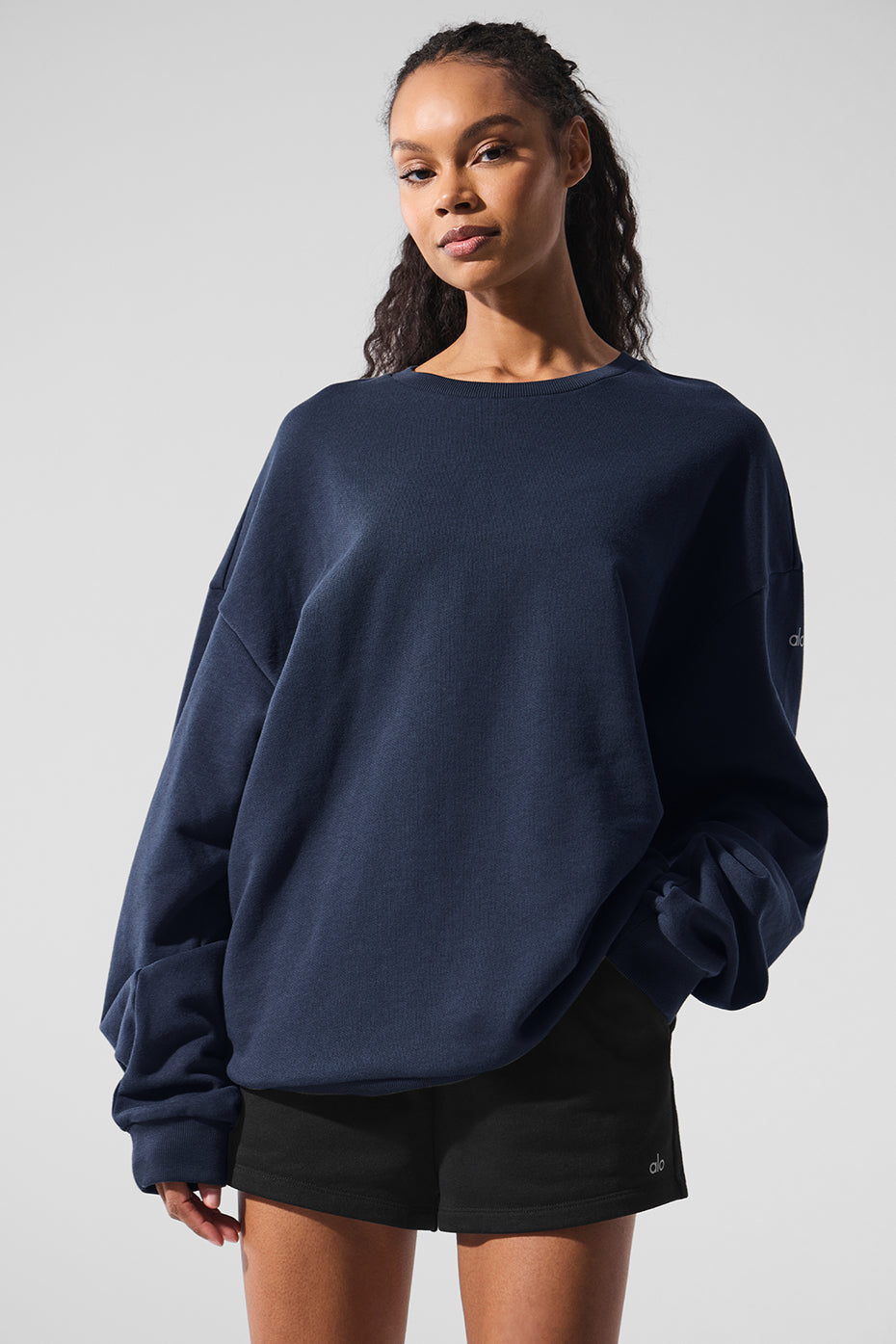 Close-up of the navy blue sweatshirt fabric texture.