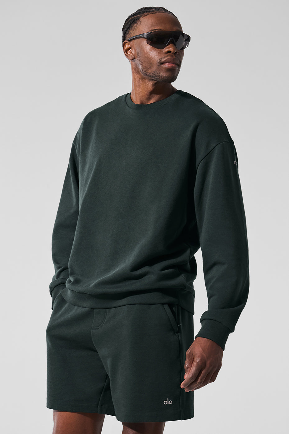 Charcoal green workout sweatshirt on display, showcasing drop shoulders and cuffs.