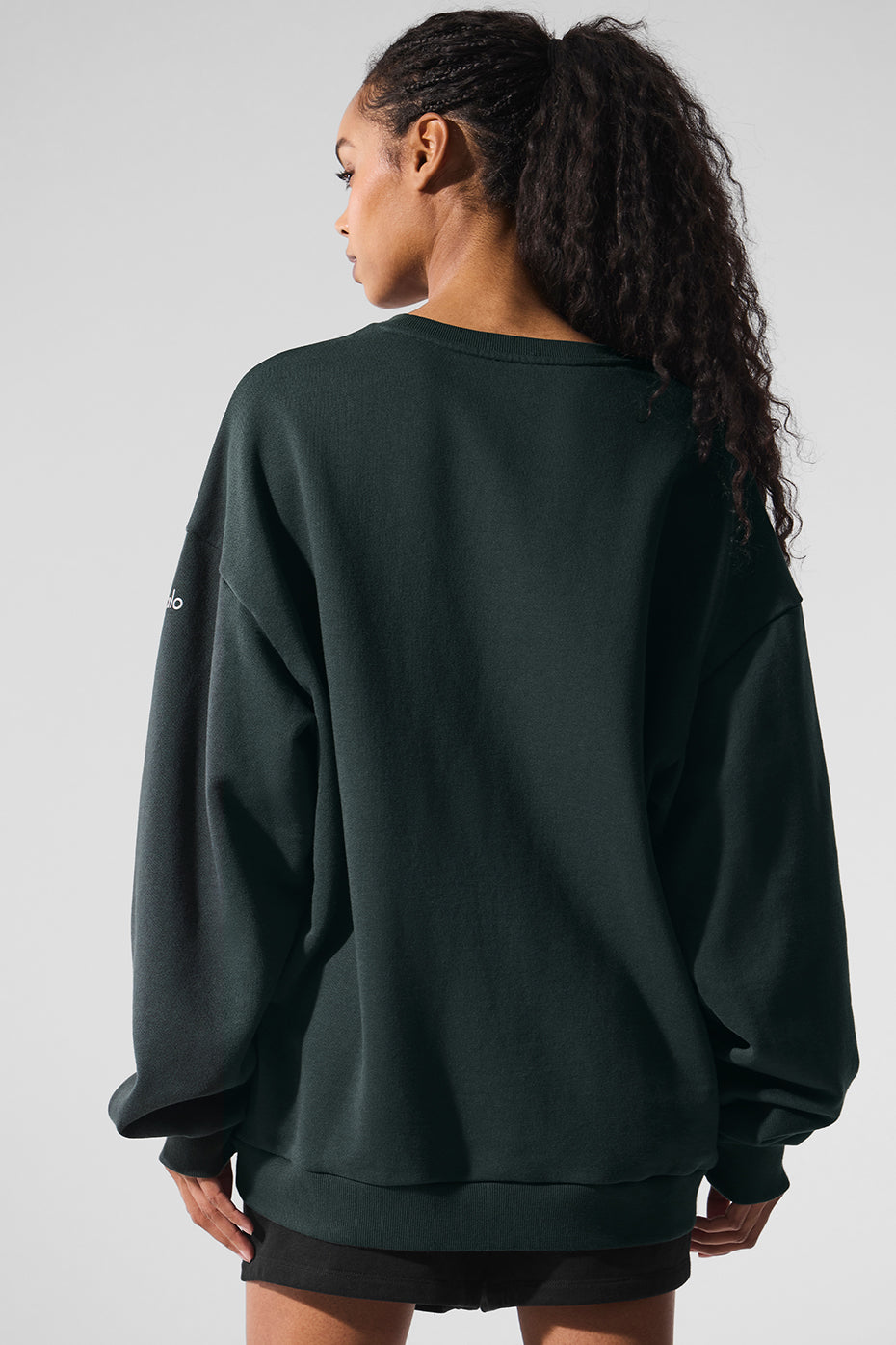 Model wearing the chill crew neck pullover during outdoor workout in park setting