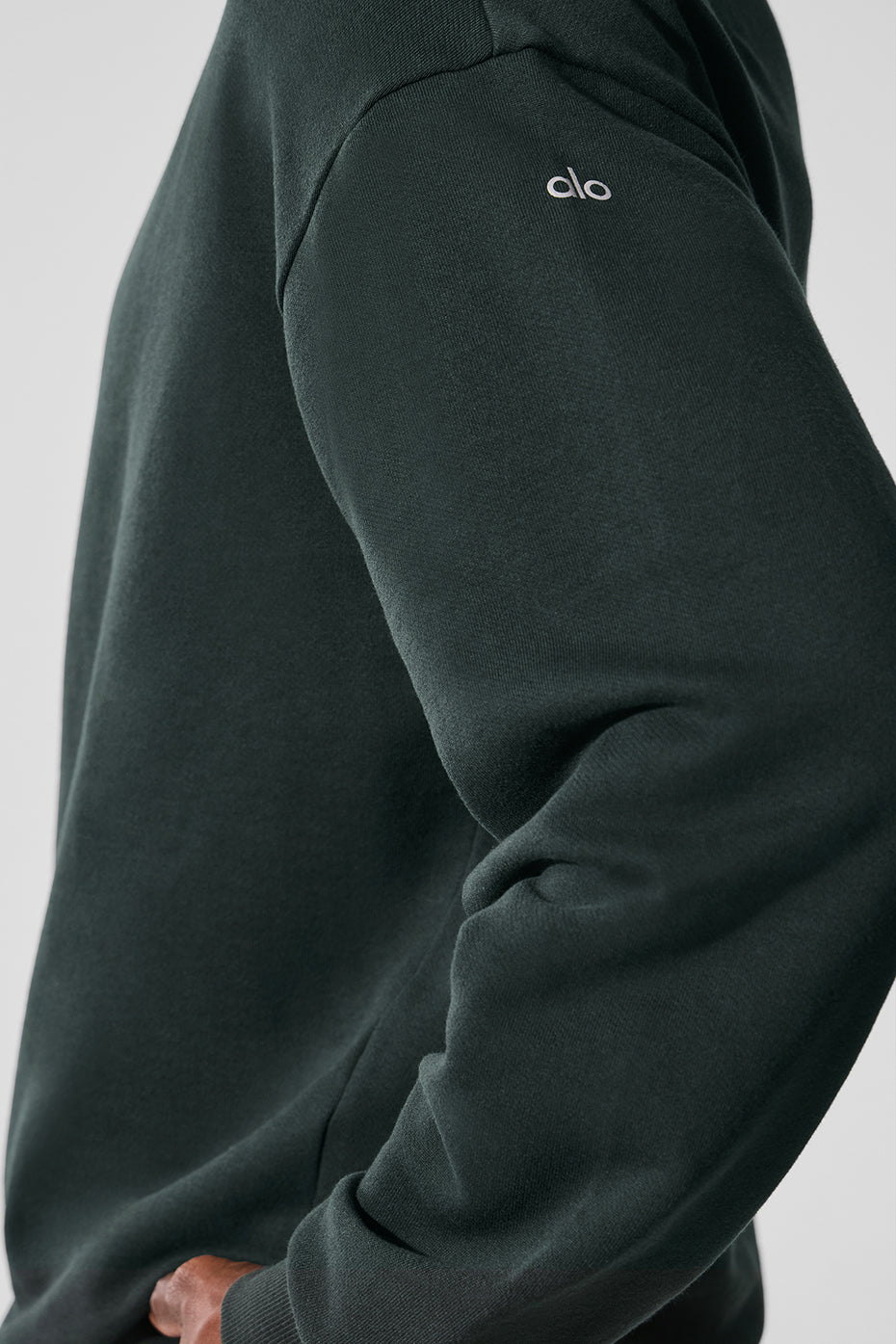 Charcoal green workout sweatshirt on display, showcasing drop shoulders and cuffs.