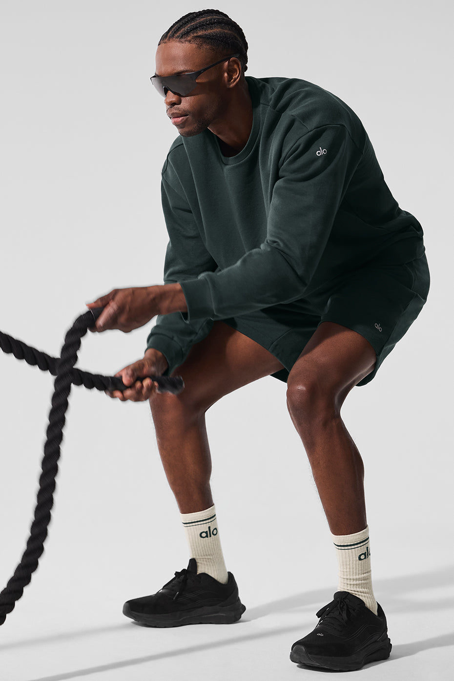 Model wearing Chill workout sweatshirt during an outdoor fitness session.