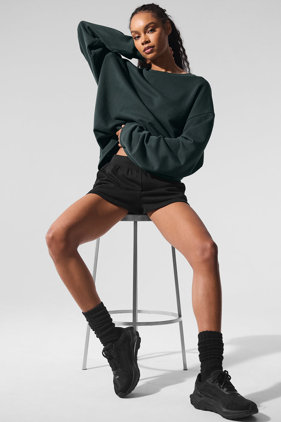 Model wearing the chill crew neck pullover during outdoor workout in park setting