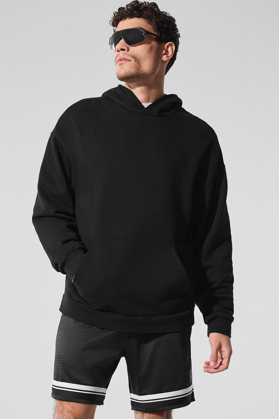 Front view of the essential black chill hoodie, showcasing its sleek design.