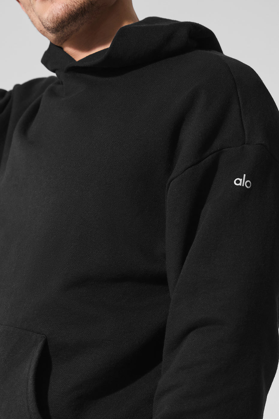 Front view of the essential black chill hoodie, showcasing its sleek design.