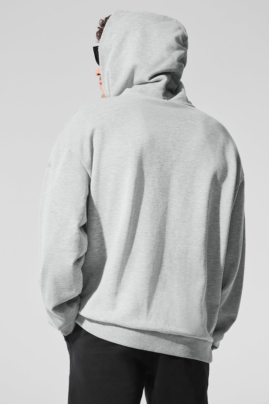 Casual look featuring the hoodie paired with workout clothes.