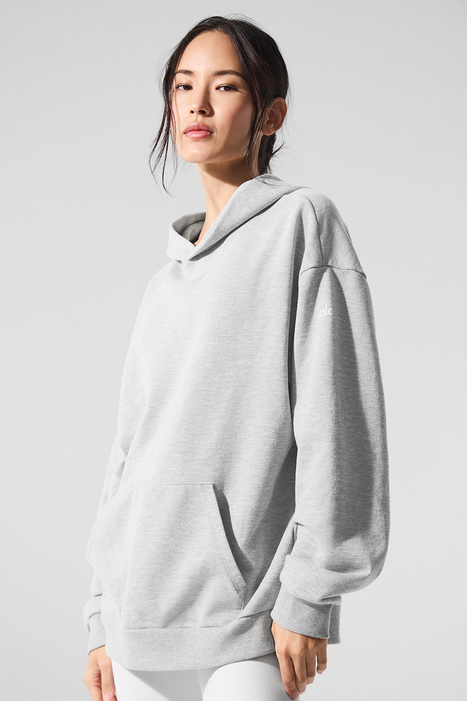 Casual shot of the hoodie styled for a relaxed day out in the city
