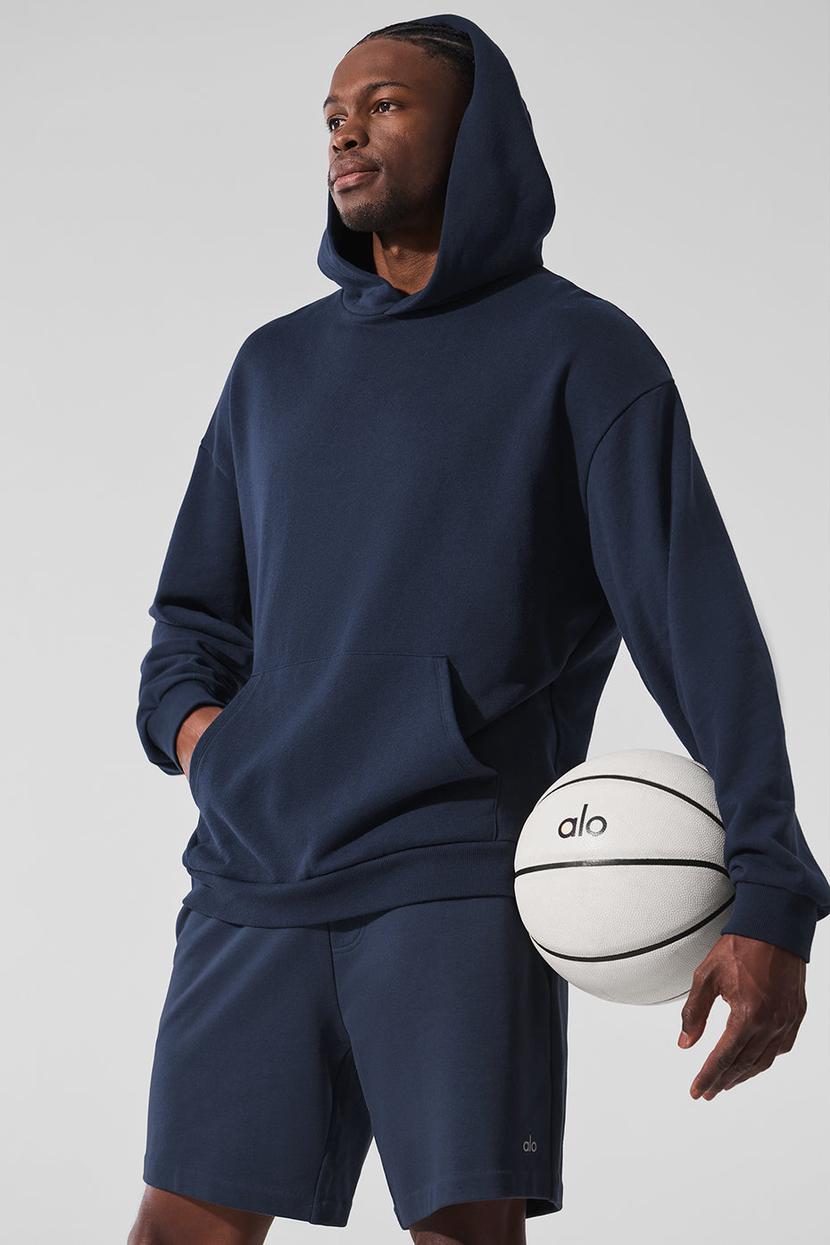 Navy essential comfort hoodie worn during a workout session.