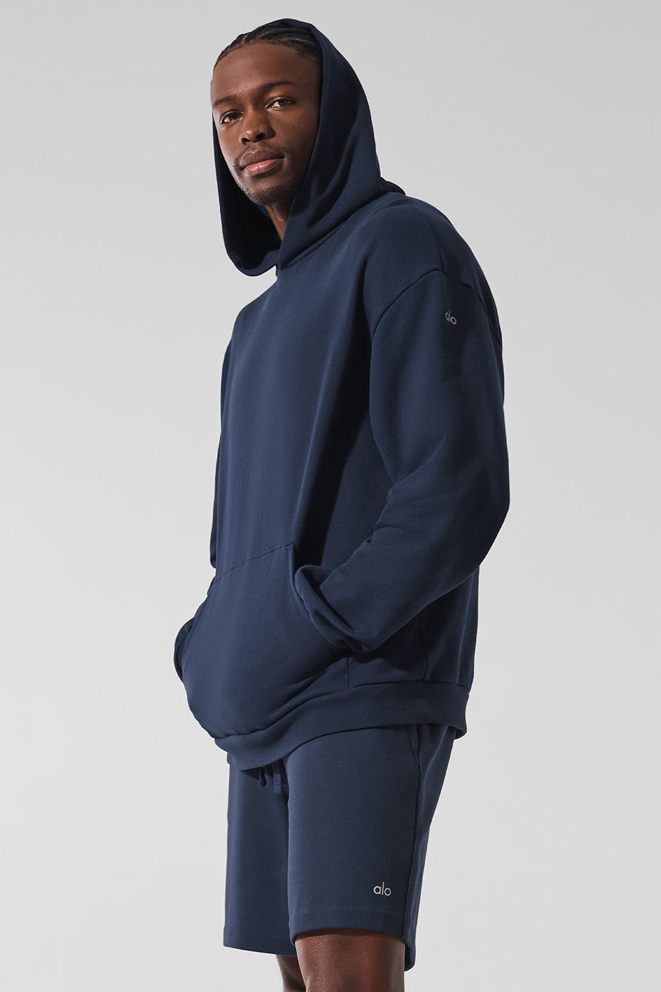 Navy essential comfort hoodie worn during a workout session.