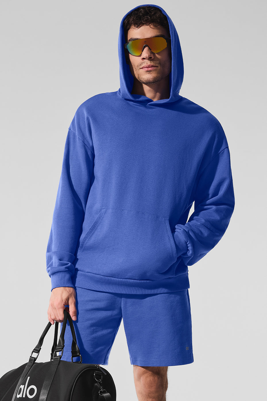 Front view of the Marathon Blue Chill Hoodie on a model, showcasing its relaxed fit and vibrant color