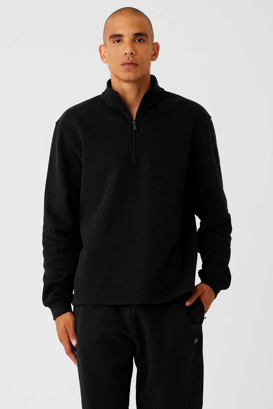 Front view of black fleece quarter zip sweatshirt, ideal for training.