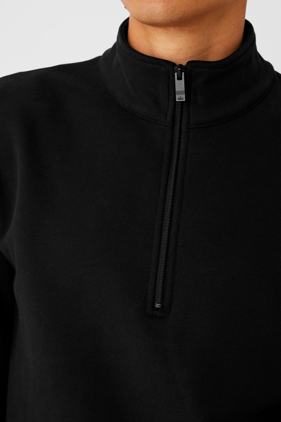 Front view of black fleece quarter zip sweatshirt, ideal for training.