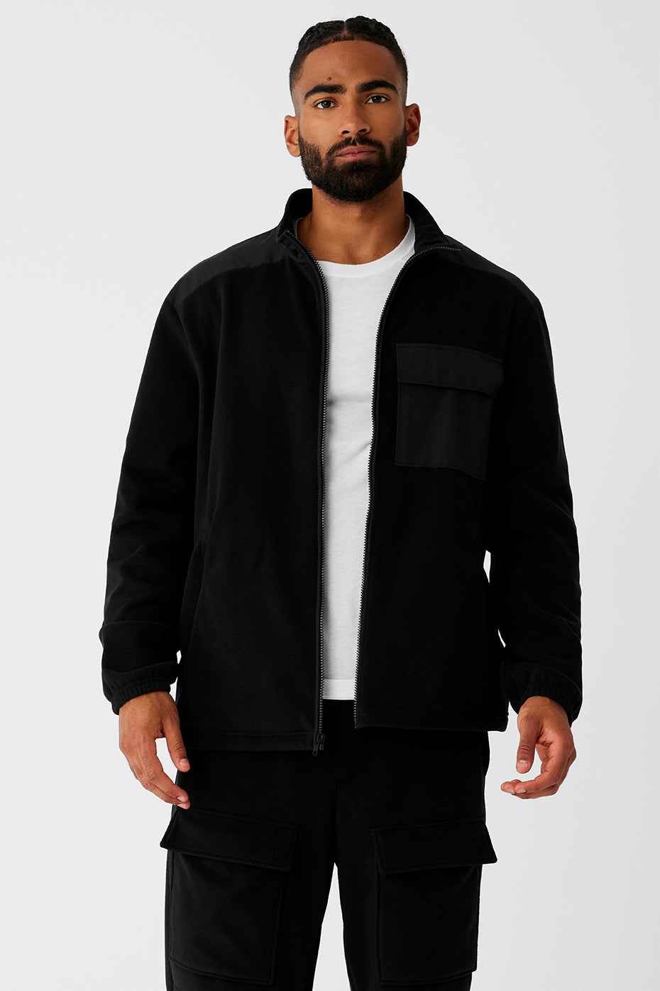 Front view of the black women's fleece jacket with full zip closure