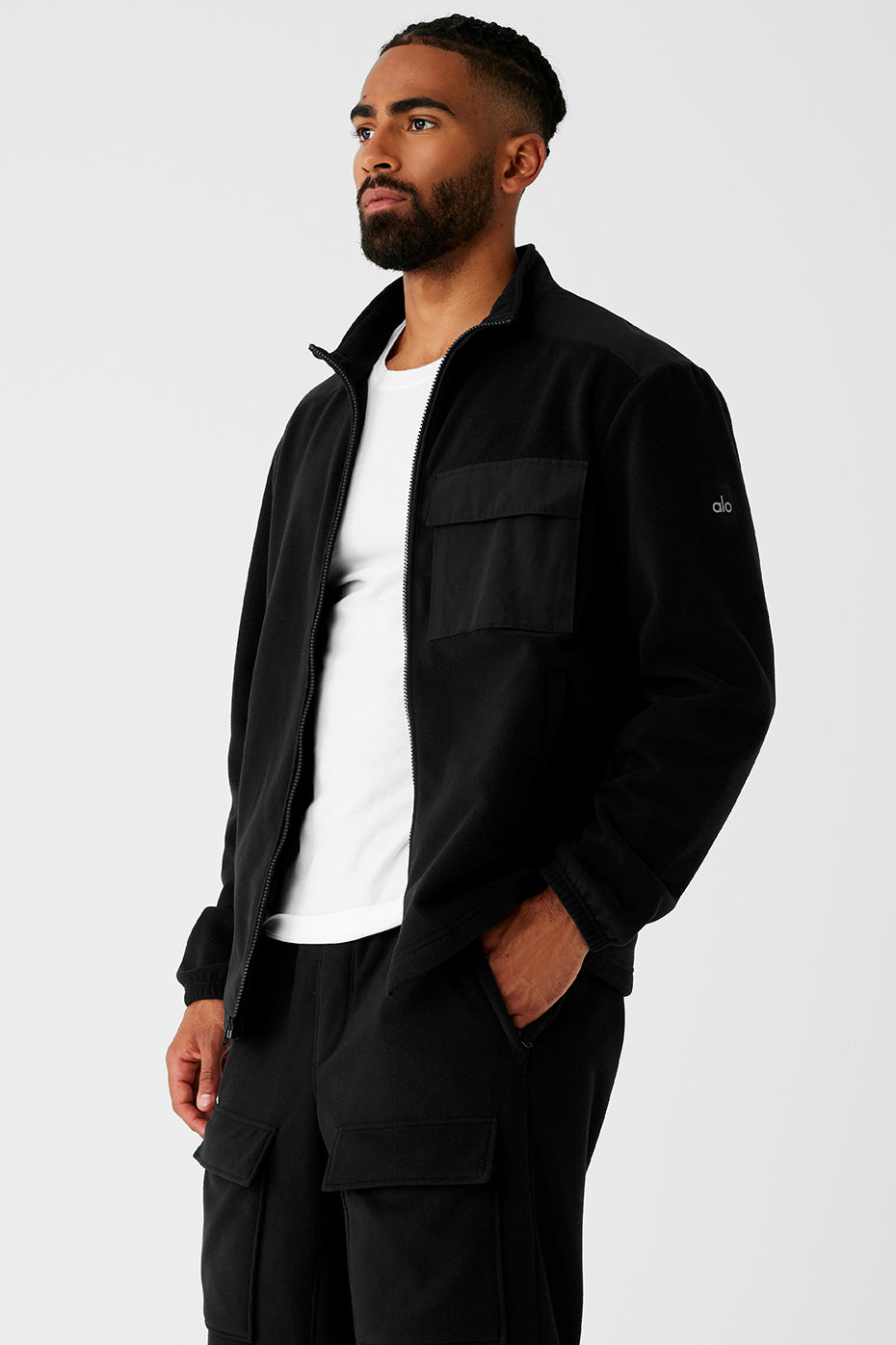 Model wearing the fleece jacket in outdoor mountain setting
