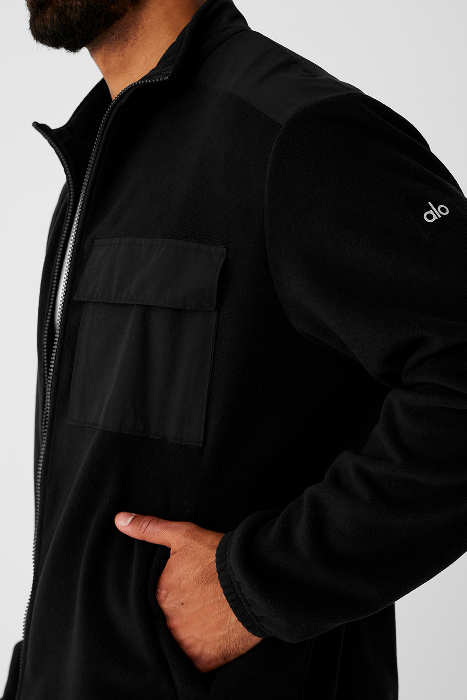 Front view of the black womens fleece jacket with full zip closure